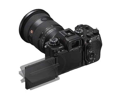 Ecco una fotocamera nera con un obiettivo grande e uno schermo ribaltabile su uno sfondo bianco.