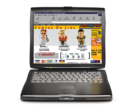 Un laptop nero aperto mostra una pagina web "Compra On Line" con immagini e testo su sfondo bianco. La tastiera � visibile.