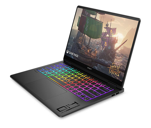 Un computer portatile nero aperto mostra un'immagine di un veliero su uno schermo luminoso e una tastiera retroilluminata arcobaleno.
