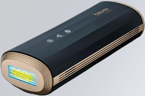 Dispositivo nero e oro con luce gialla. Ha pulsanti bianchi e strisce dorate laterali.