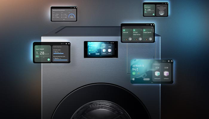 Lavatrice grigia con oblò nero e schermi digitali che mostrano informazioni e opzioni di controllo.