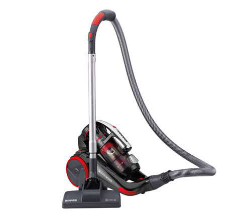 Aspirapolvere grigio e rosso con tubo flessibile su sfondo bianco. La spazzola � appoggiata a terra.