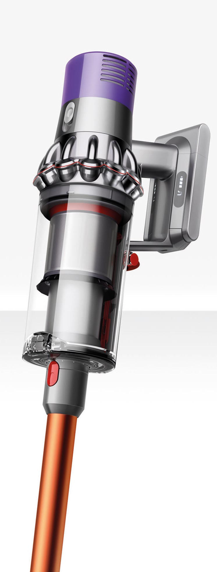 Aspirapolvere senza fili: corpo viola e grigio, contenitore trasparente, tubo arancione, su sfondo bianco.