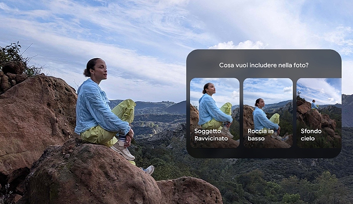 Donna seduta su una roccia e dietro un paesaggio montano