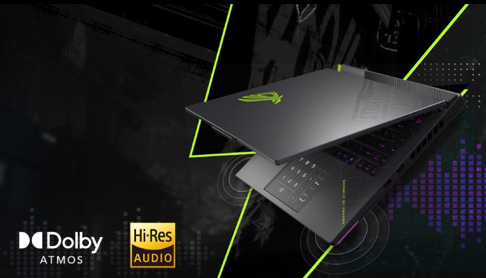 Un portatile rog 14 semi aperto su uno sfondo grigio astratto con linee verdi