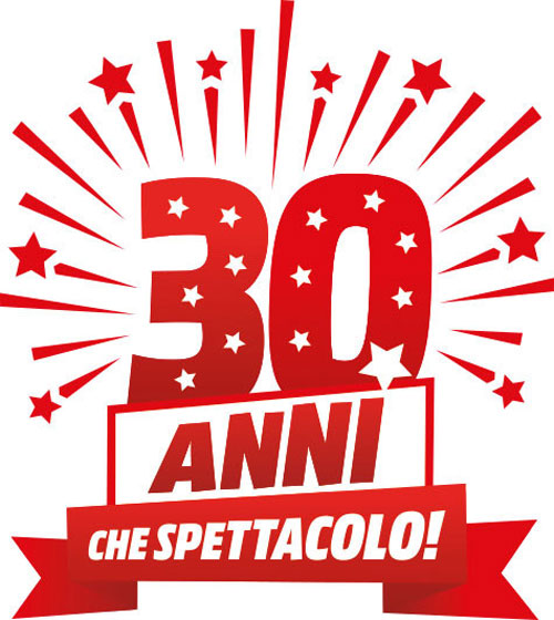 Festivo logo rosso e bianco con "30" stellato, "ANNI" e banner "CHE SPETTACOLO!". Stelle e raggi rossi decorano.