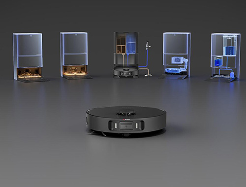 Un aspirapolvere robot nero di fronte a cinque stazioni di pulizia con liquidi colorati.