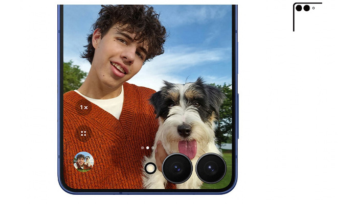 foto su un telefono di un ragazzo in posa che tiene in mano il suo cane 