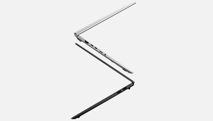 Due portatili: uno argento aperto, l'altro nero chiuso, su sfondo bianco.