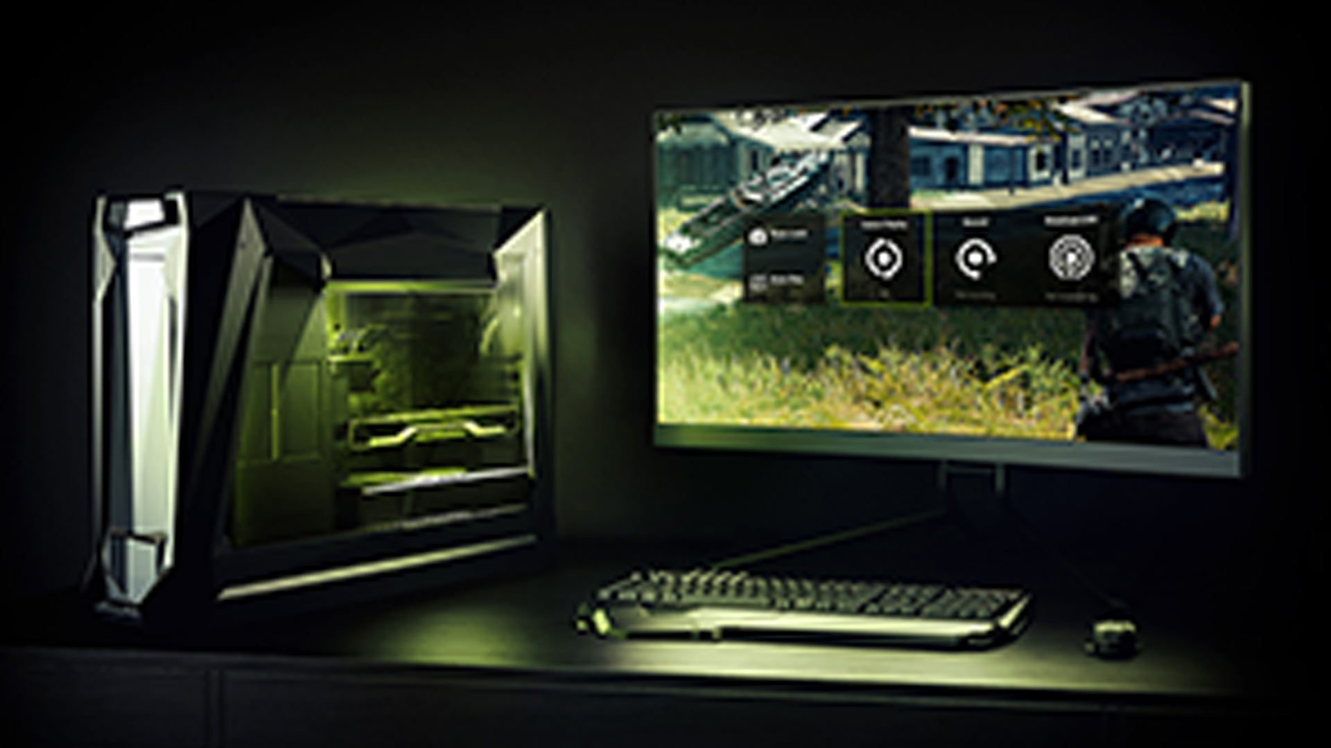Computer da gaming illuminato accanto a monitor con gioco e tastiera su scrivania scura.