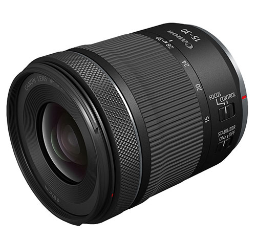 Obiettivo Canon nero con anello di messa a fuoco zigrinato e selettori per stabilizzatore e controllo focus.