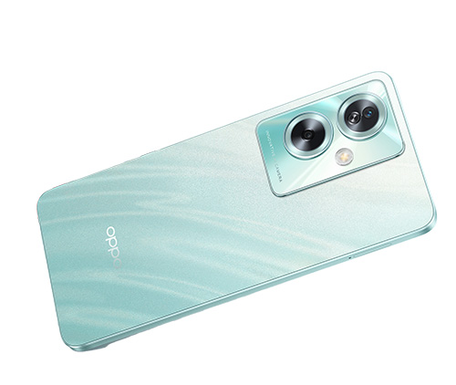 Telefono azzurro-verde con due obiettivi fotografici e flash sulla parte superiore.