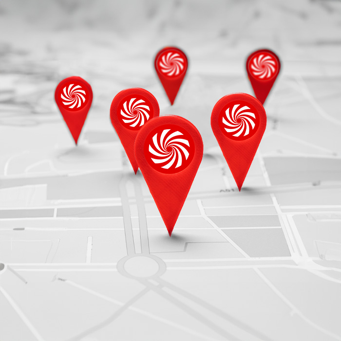 Mappa grigia con segnaposti rossi che indicano posizioni. Ogni segnaposto ha un simbolo a spirale bianco.