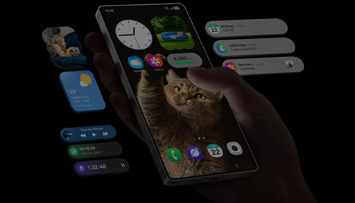Una mano tiene un telefono che mostra un gatto. App e notifiche galleggiano attorno allo schermo.