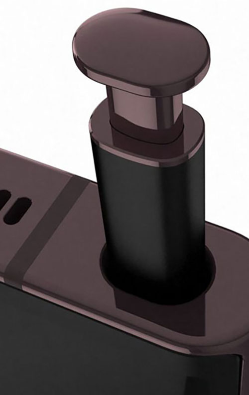 Erogatore nero e marrone con pulsante rotondo su superficie, su sfondo bianco.