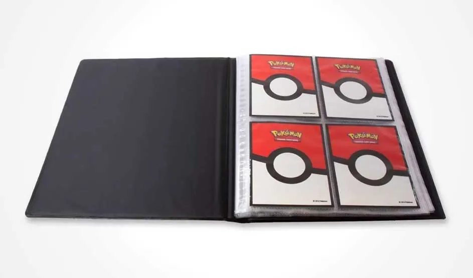 Open black binder displaying four Pokemon trading cards with red and white Pokeball designs on white background.