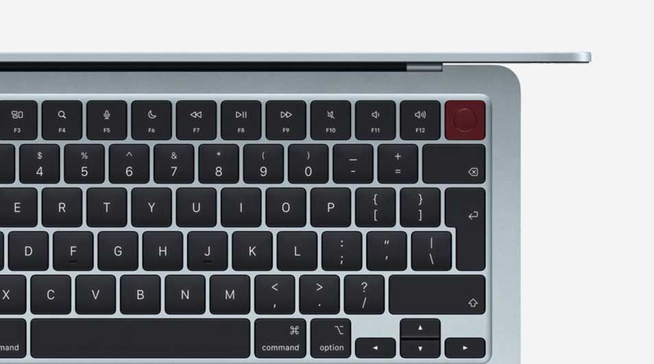 Detailed view of a keyboard with dark keys and a distinctive red Touch ID button in the top right, beneath a slim lid.
