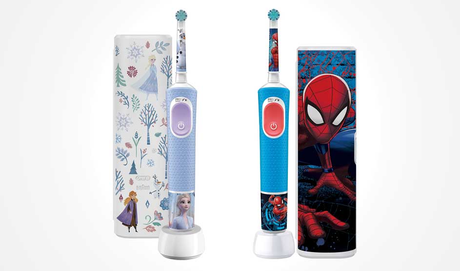 Two bright children’s toothbrushes with Frozen and Spiderman designs stand before matching cases on a clean white background.