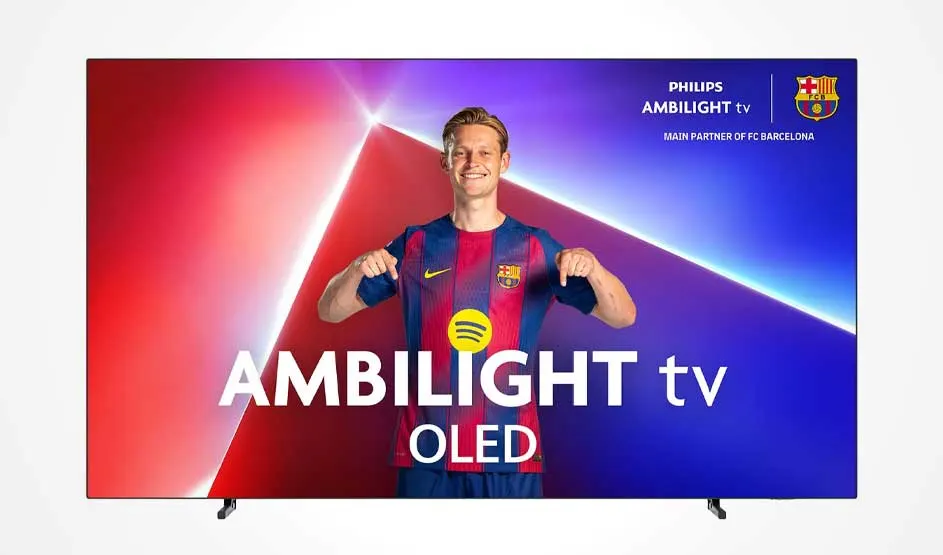 A Philips AMBILIGHT OLED television displays an FC Barcelona footballer in red and blue kit. Gradient background in red, purple and blue. Official FC Barcelona partner. Premium OLED display technology showcase.