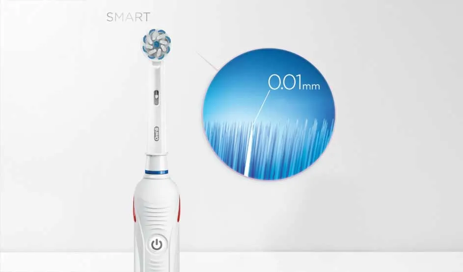 White electric toothbrush with blue brush head and circular magnified detail showing 0.01mm bristle precision.