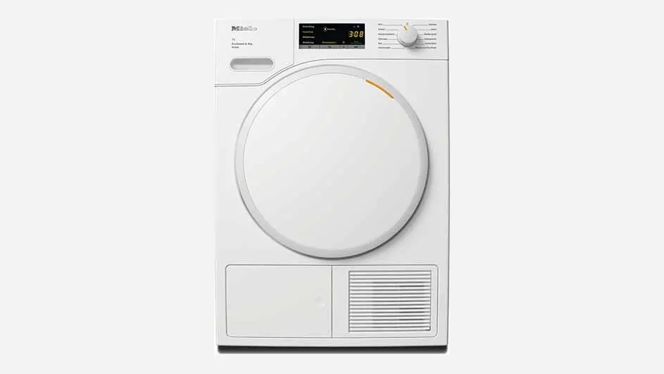A white Miele tumble dryer with a large round door, digital display, and control knob is shown on a plain background, ready for drying.