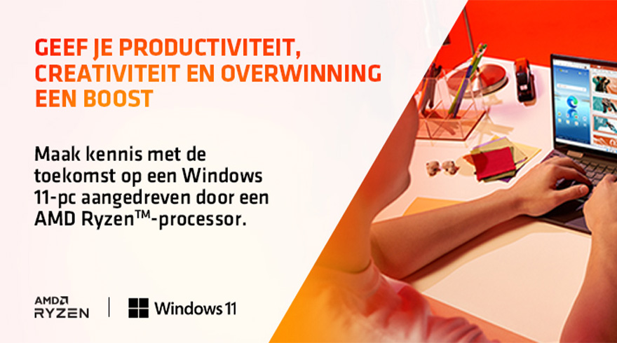 Laptop op een bureau met kantoorartikelen en handen die typen; AMD Ryzen en Windows 11 logo's.