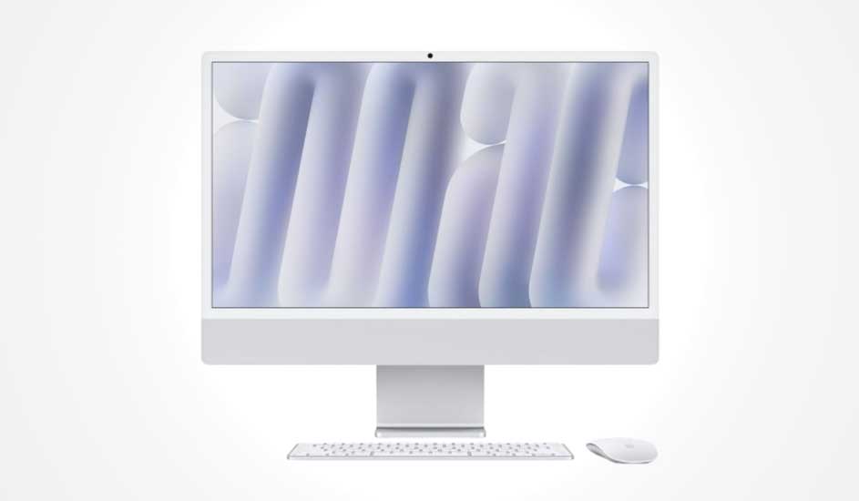 Een moderne, witte all-in-one desktopcomputer met groot scherm, toetsenbord en muis, alles strak en minimalistisch vormgegeven. Het merk is Apple.