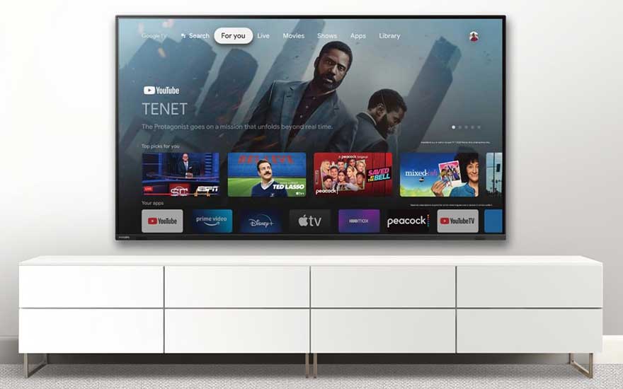 Google TV home screen with recommended content and popular apps.