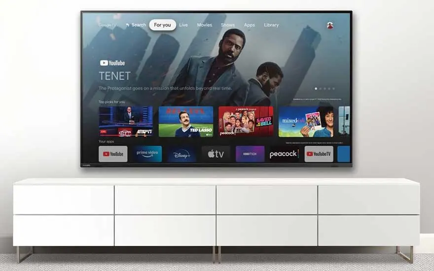 Google TV home screen with recommended content and popular apps.