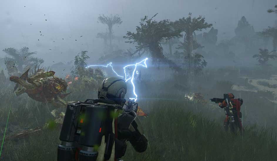 This is a video game. In Arrowhead’s Helldivers 2, two armoured players battle huge alien beasts in a stormy, wild jungle using advanced weapons.