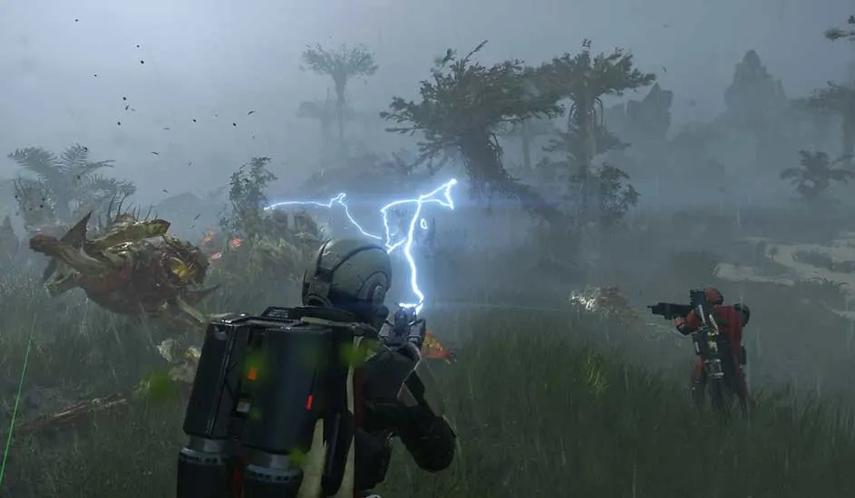 This is a video game. In Arrowhead’s Helldivers 2, two armoured players battle huge alien beasts in a stormy, wild jungle using advanced weapons.