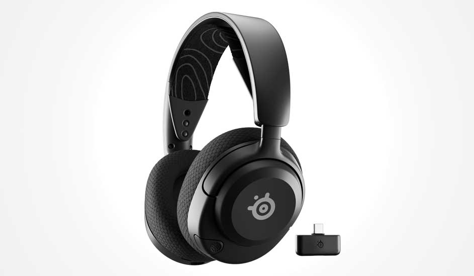 A sleek black wireless gaming headset with cushioned earcups stands beside its small USB-C dongle on a clean white background.