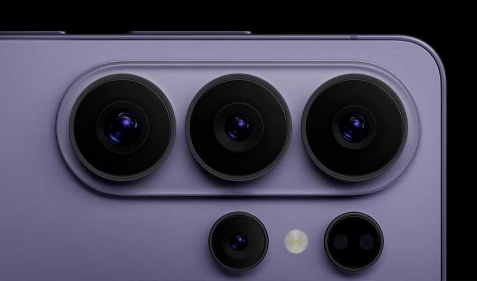 Close-up van een paars smartphonecamera-eiland met vijf ronde lenzen en een flitser, strak verlicht tegen een diepe zwarte achtergrond.