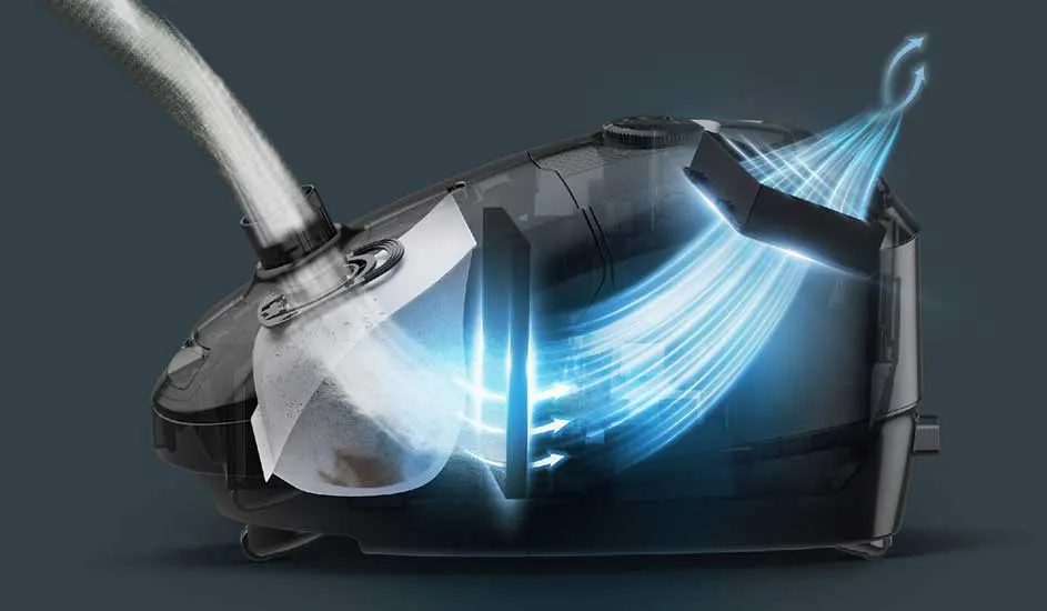 Een doorsnede van een stofzuiger toont hoe lucht met vuil door een slang wordt gezogen, gefilterd wordt en als schone lucht naar buiten stroomt.