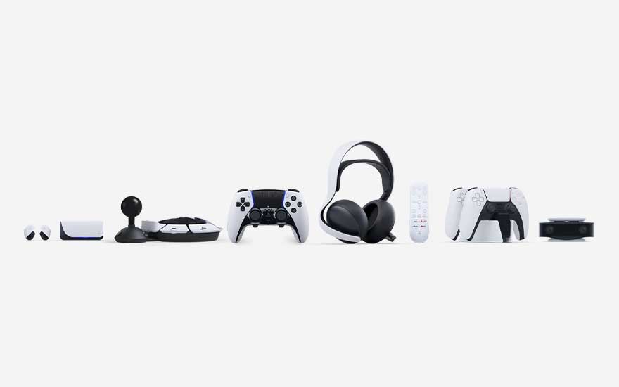 A line of PlayStation accessories sits on a white backdrop: controllers, headset, remote and camera forming one sleek ecosystem.