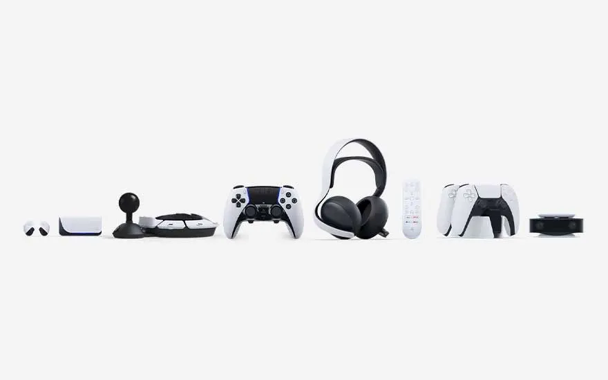 A line of PlayStation accessories sits on a white backdrop: controllers, headset, remote and camera forming one sleek ecosystem.