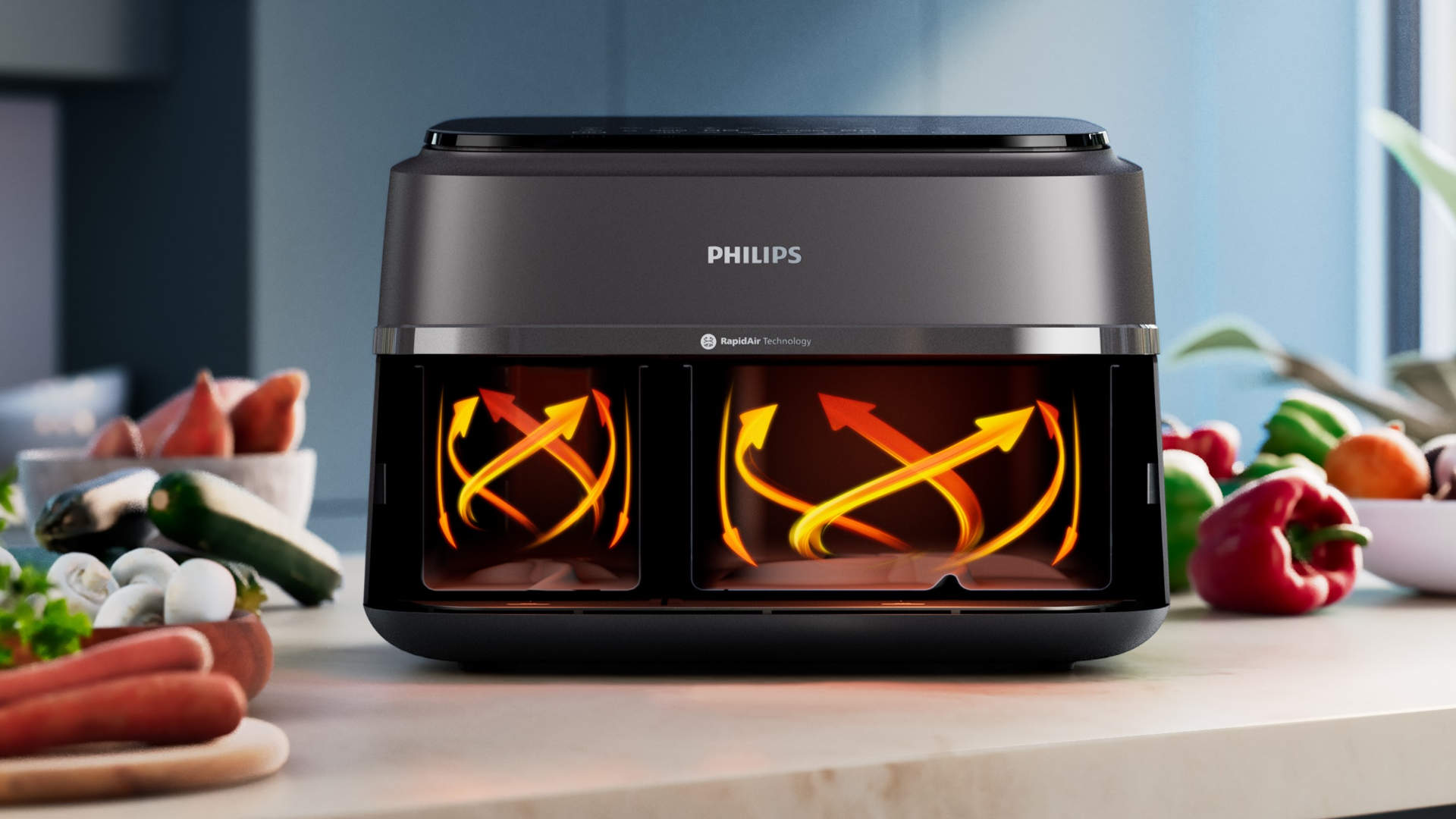 Een Philips airfryer met dubbele compartimenten, omgeven door groenten. Oranje pijlen tonen de luchtcirculatie in de compartimenten.