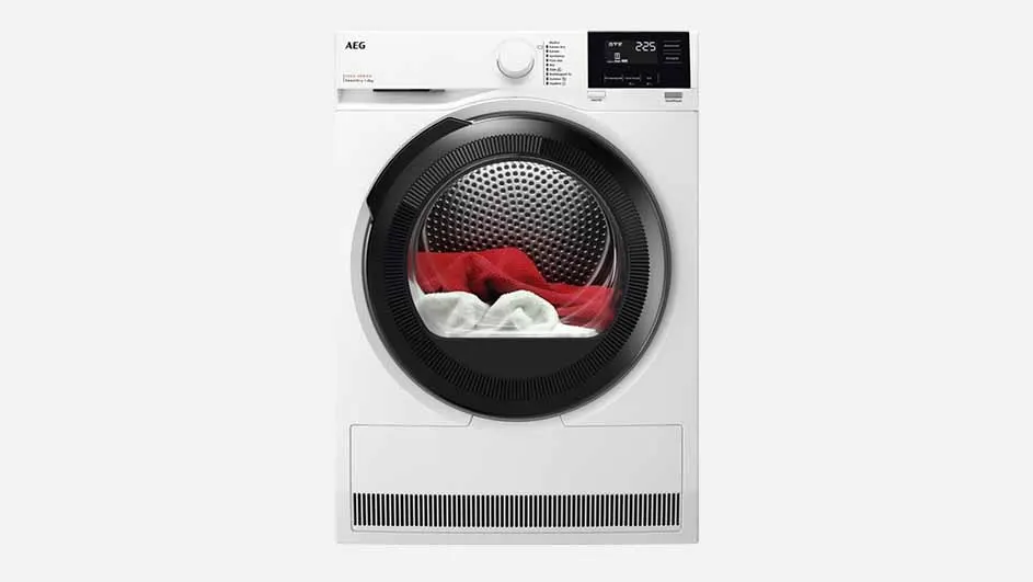 A white AEG tumble dryer with a round black door and digital display is shown, filled with red and white laundry, ready for drying.