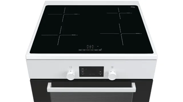 The image shows a white oven with a black stovetop that has four cooking zones marked by white crosses. Below, are two knobs and a screen.