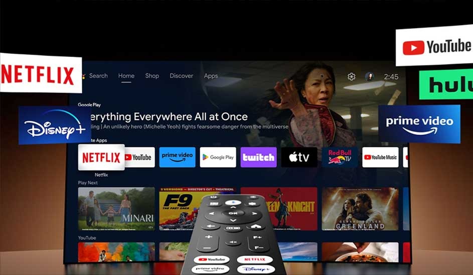 A smart TV interface displays popular streaming apps such as Netflix, Disney+, YouTube, Hulu, and Prime Video. A remote control is in the foreground. No brand shown.
