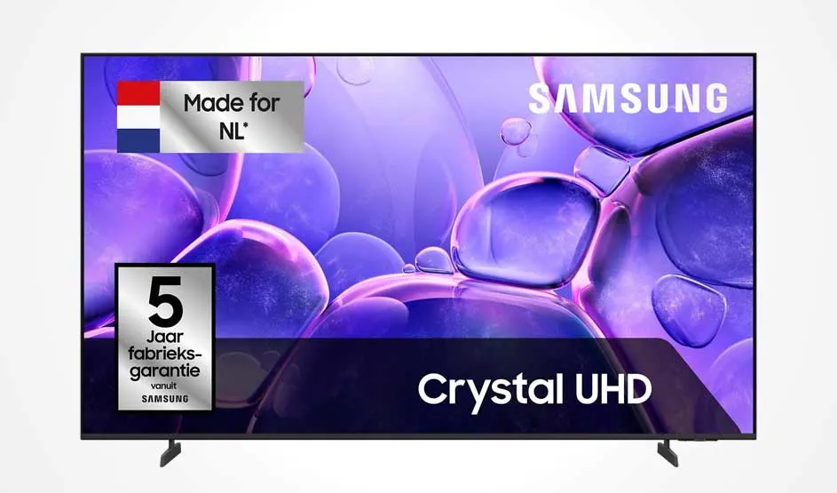 Een Samsung-tv toont paarse abstracte vormen, met labels voor Crystal UHD en vijf jaar fabrieksgarantie.