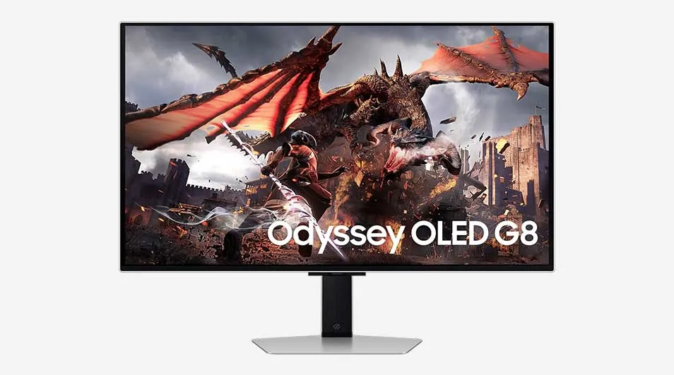 Een Samsung Odyssey OLED G8-monitor toont een epische scène waarin een ridder onder een vurige draak vecht, met verwoeste gebouwen op de achtergrond