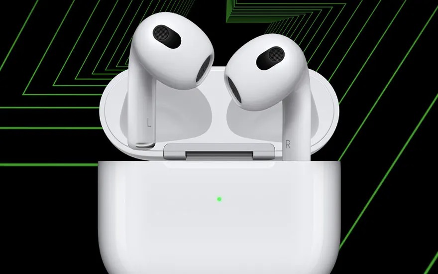 A white pair of wireless earbuds stands upright in an open charging case, set against a bold black and green graphic background.