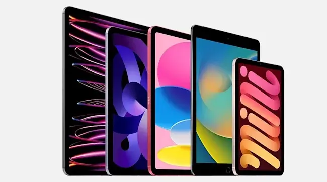 Five tablets of varying sizes stand in a row, displaying colorful abstract screens.
