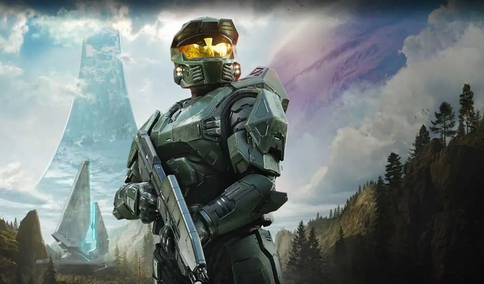 It’s a video game: an armoured sci‑fi soldier with a rifle stands before ringworld towers, mountains and pines under moody skies.