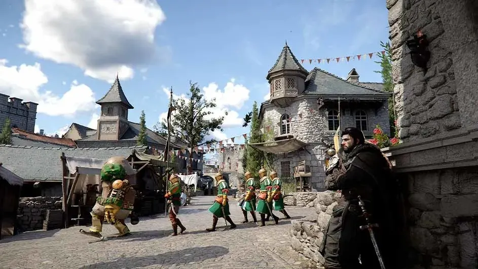 Videogame: Medieval square with bunting; soldiers march past a market as a sworded man watches from the shade by a stone wall.