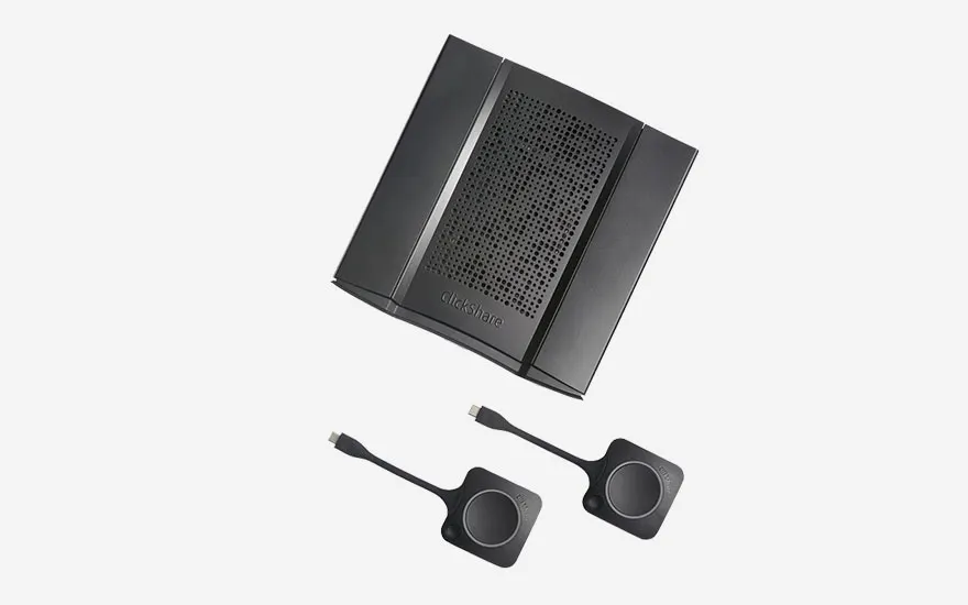Geavanceerde ClickShare conferentie-eenheid met geïntegreerde luidspreker en twee USB-C dongles voor professionele vergaderingen.