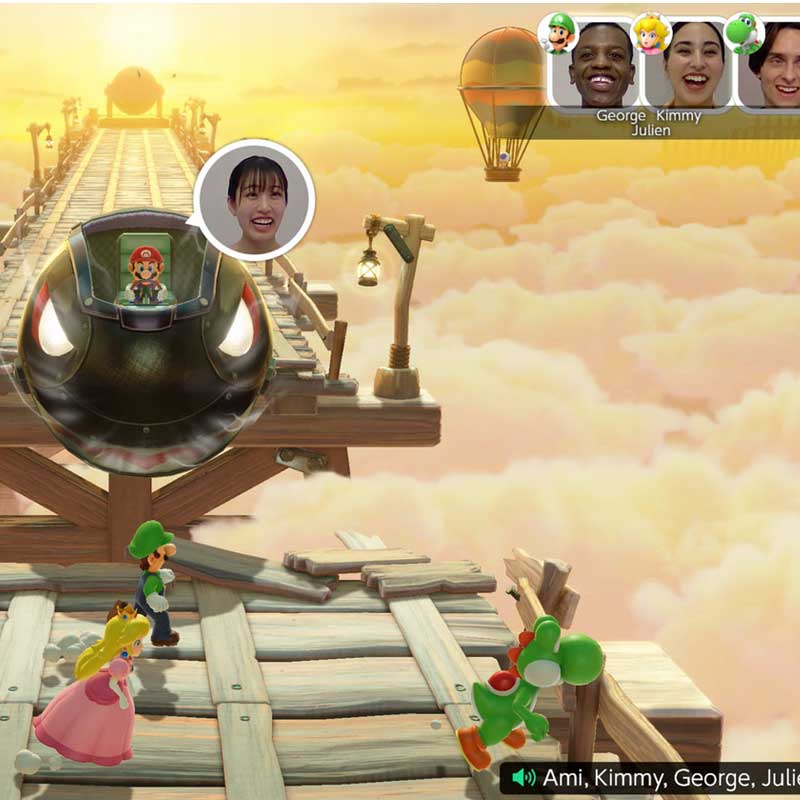 Op een houten brug staan de personages Luigi, Peach en Yoshi uit het videospel Mario Party. Links een grote kogel met Mario erin.