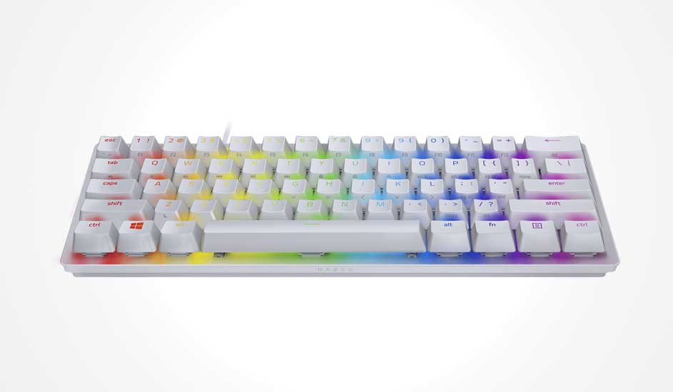 Compact white mechanical keyboard with tall keycaps, soft rainbow glow between them and a slim frame that keeps the gaming setup bright.