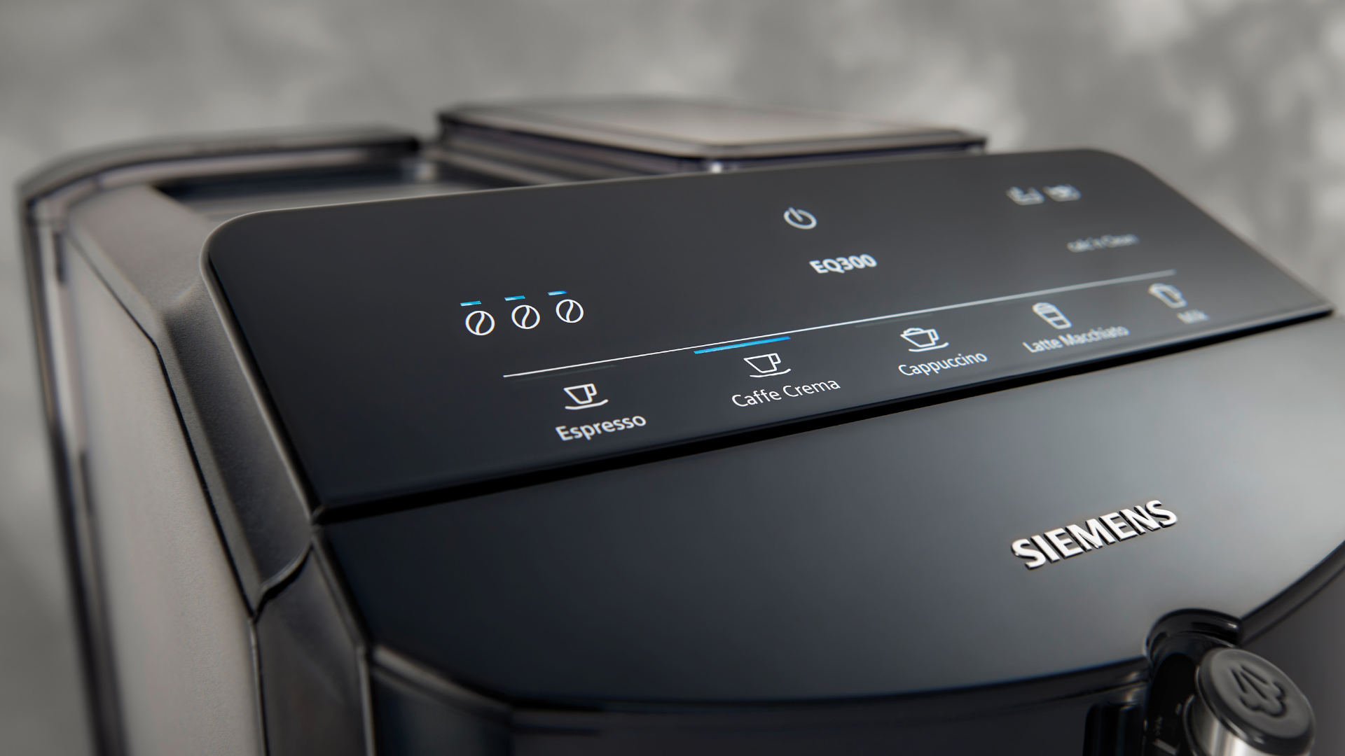 Close-up van een zwart Siemens EQ300 koffiezetapparaat met knoppen voor espresso, caffè crema, cappuccino en latte macchiato.